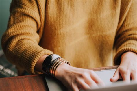 A woman at a laptop or crafting time